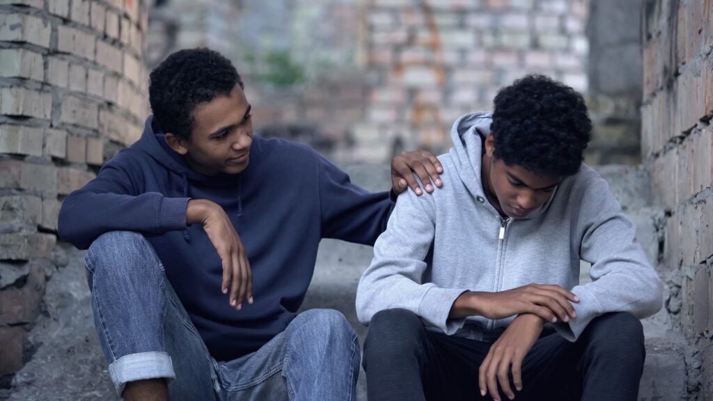 Friend helping friend when he is wondering how long does it take to recover from depression