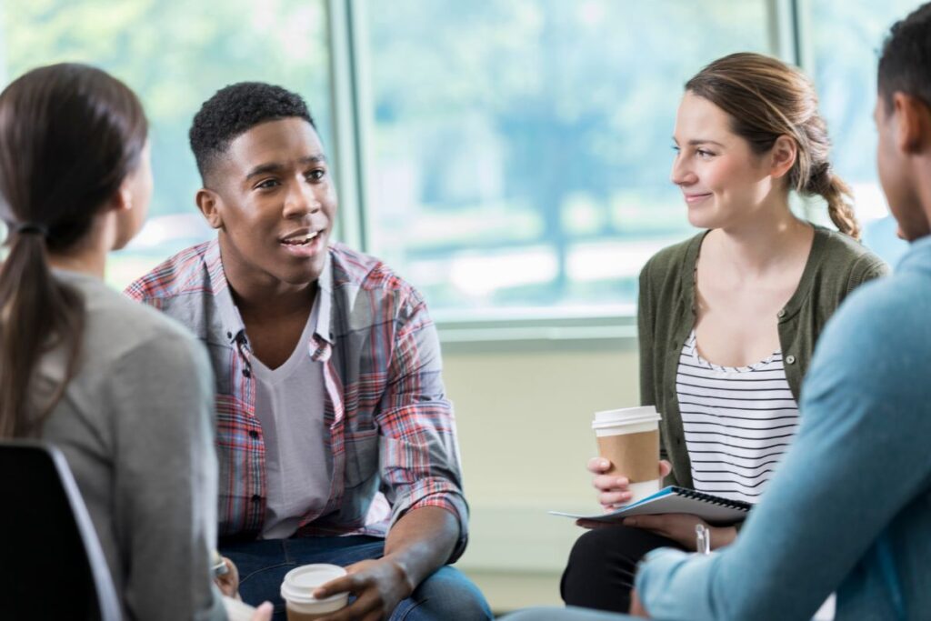 young adults talk in a mental health support group